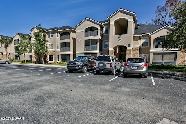 940 Village Trl Unit 6-109, Port Orange, FL 32127 - view of property featuring uncovered parking