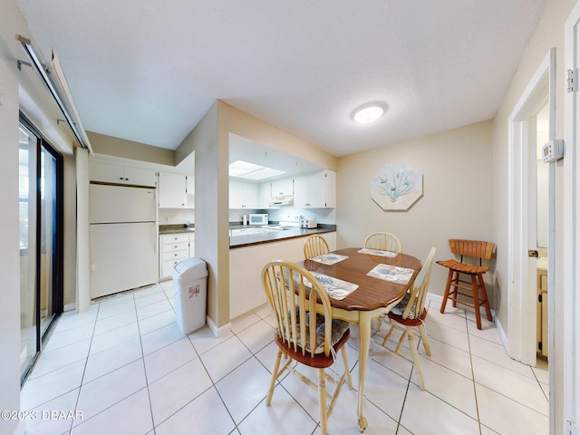 dining area with light tile patterned floors