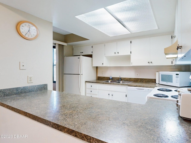 kitchen featuring white cabinetry, sink, and white appliances