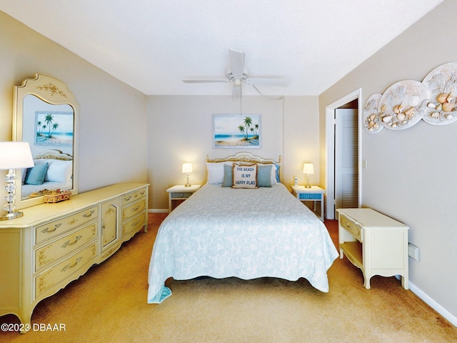 carpeted bedroom featuring ceiling fan