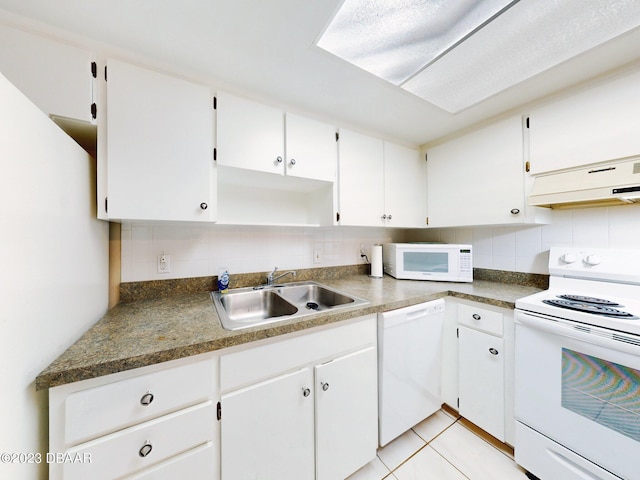 kitchen featuring white cabinets, sink, white appliances, and backsplash