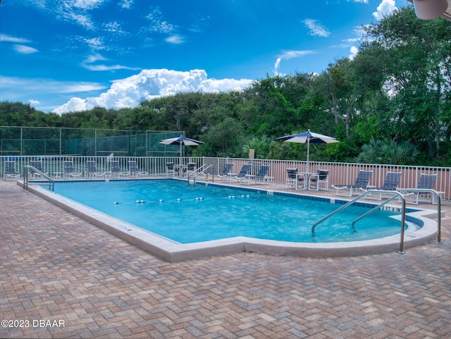 view of pool featuring a patio