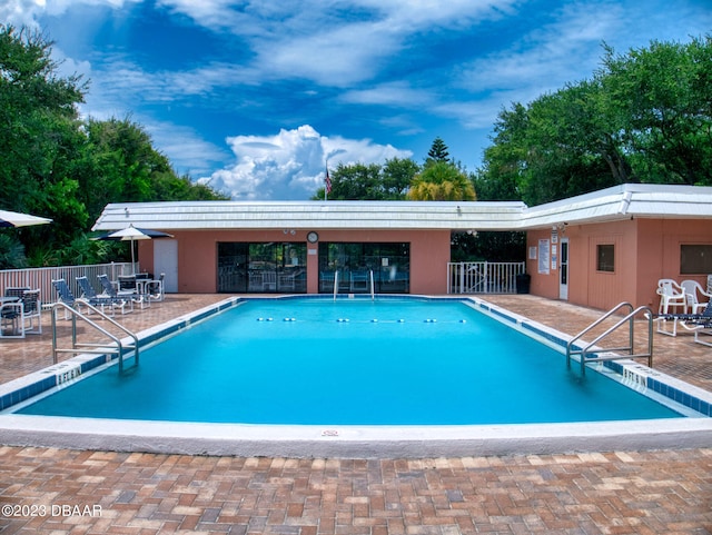 view of pool featuring a patio area