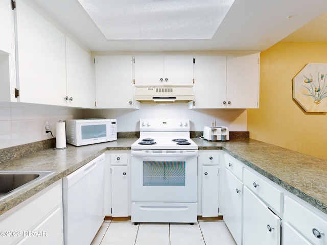 kitchen featuring extractor fan, tasteful backsplash, white cabinets, and white appliances