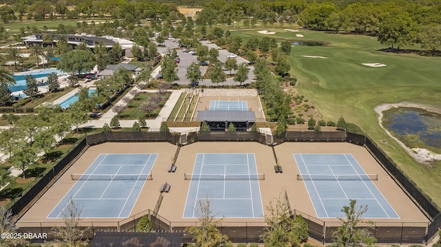 birds eye view of property featuring a water view and view of golf course