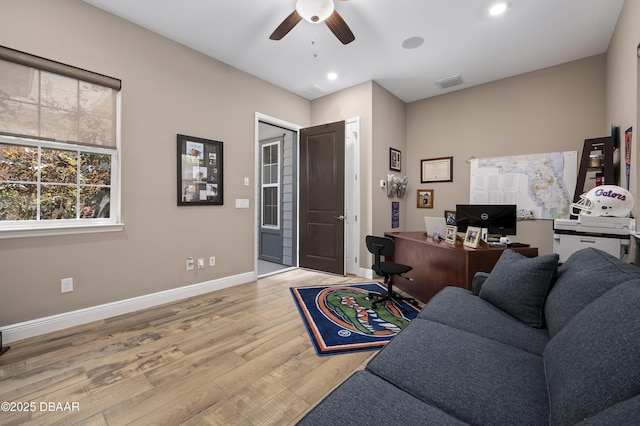office space featuring a ceiling fan, visible vents, baseboards, light wood-style floors, and recessed lighting