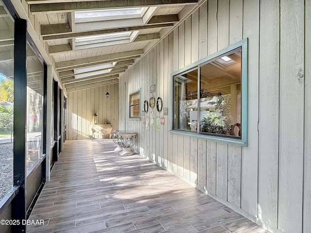 exterior space featuring a skylight and a healthy amount of sunlight