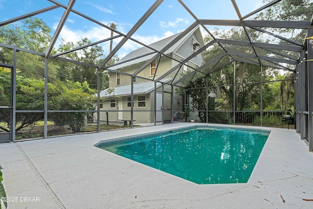 view of pool featuring a lanai and a patio area