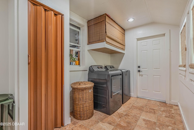 laundry area featuring cabinets and washer and clothes dryer