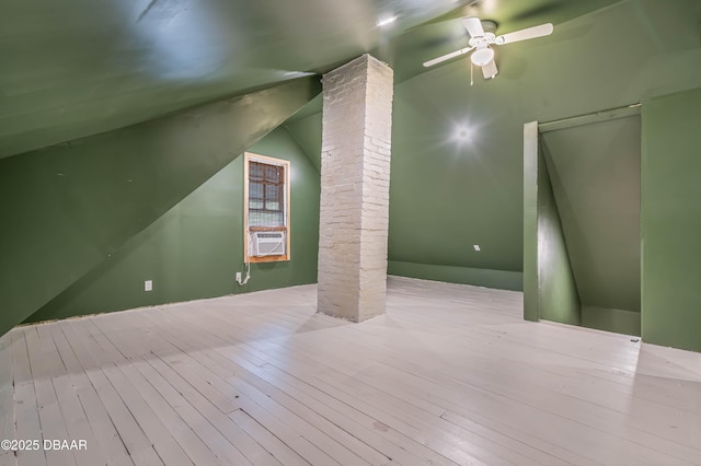 additional living space featuring ceiling fan, cooling unit, and vaulted ceiling