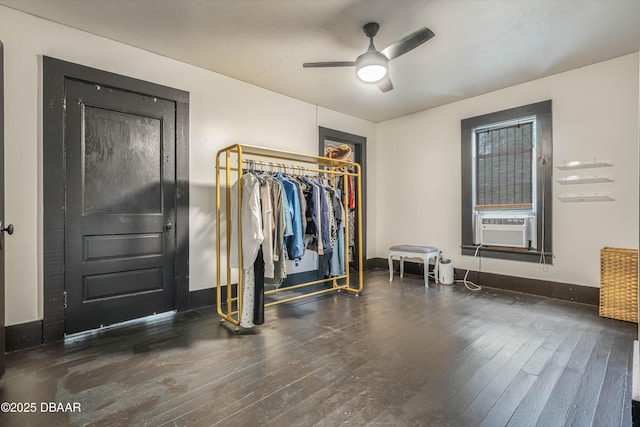 interior space featuring ceiling fan and dark hardwood / wood-style floors