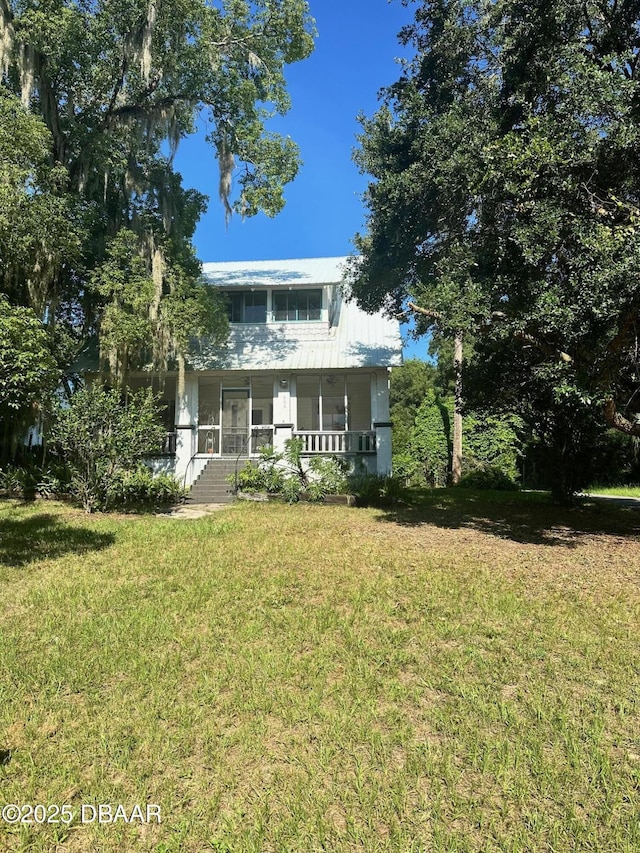 view of front facade with a front lawn and a porch