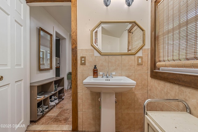 bathroom with backsplash and tile walls