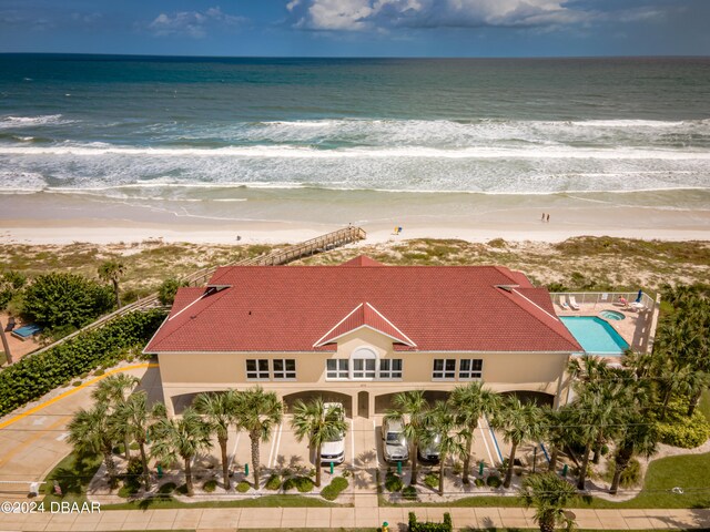 bird's eye view with a view of the beach and a water view