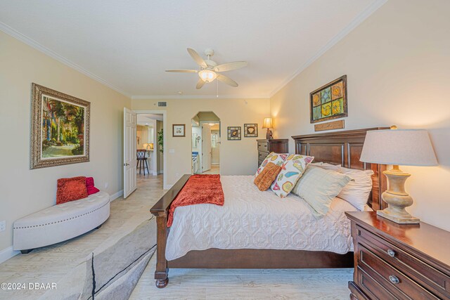 bedroom with ceiling fan, light hardwood / wood-style flooring, and crown molding