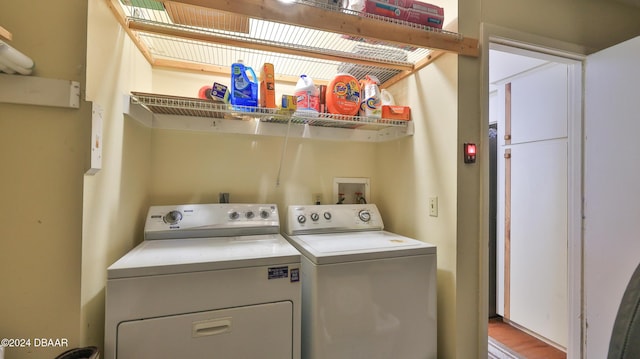 clothes washing area with washer and dryer