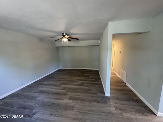 unfurnished room featuring dark hardwood / wood-style floors and ceiling fan