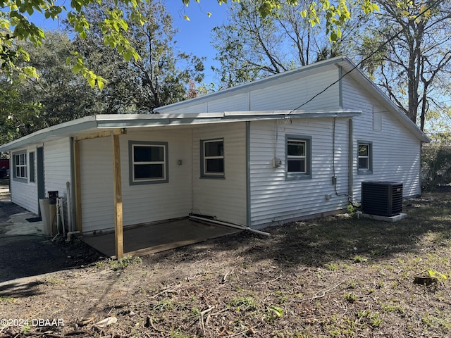 back of house featuring central AC