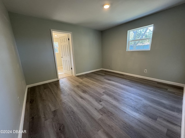 unfurnished room with hardwood / wood-style floors