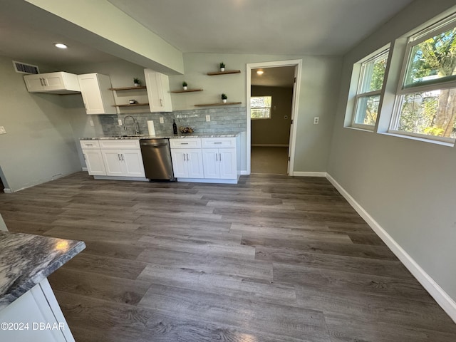 kitchen featuring light stone countertops, dishwasher, dark hardwood / wood-style flooring, decorative backsplash, and white cabinets