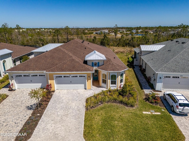 831 Coral Reef Way, Daytona Beach, FL 32124 - view of front facade featuring a front yard, decorative driveway, and an attached garage
