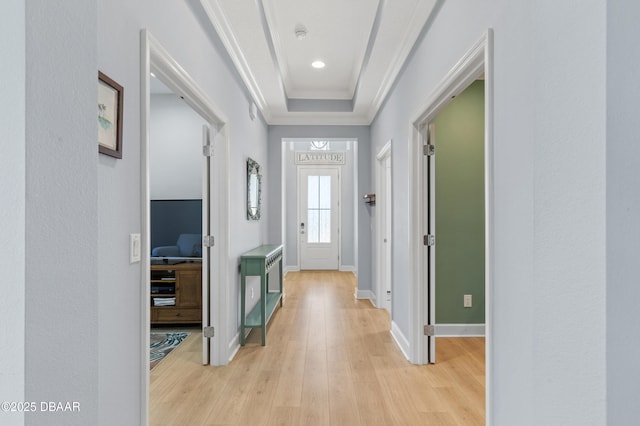 831 Coral Reef Way, Daytona Beach, FL 32124 - hall featuring a tray ceiling, baseboards, light wood-style flooring, and crown molding