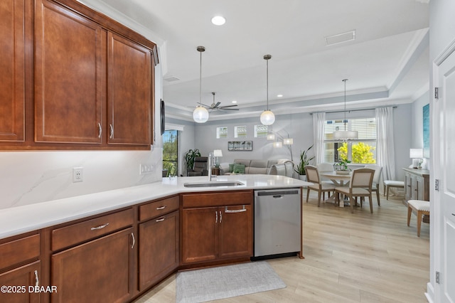 831 Coral Reef Way, Daytona Beach, FL 32124 - kitchen featuring visible vents, a sink, a tray ceiling, light countertops, and dishwasher