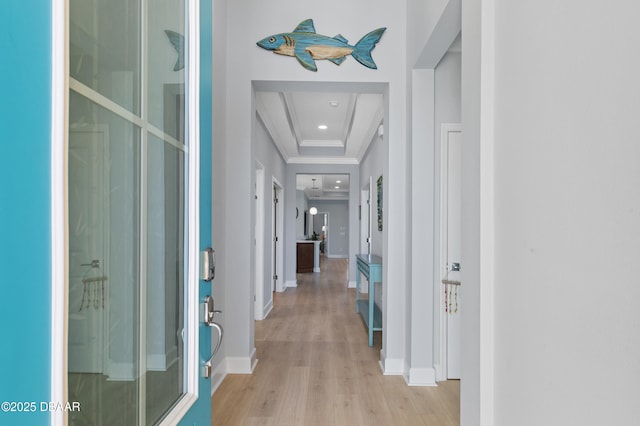 831 Coral Reef Way, Daytona Beach, FL 32124 - corridor featuring baseboards, recessed lighting, light wood-style floors, crown molding, and a raised ceiling