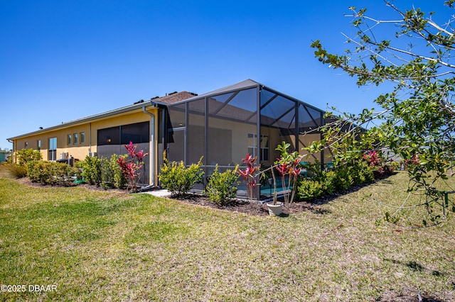 831 Coral Reef Way, Daytona Beach, FL 32124 - rear view of property featuring a lanai, a yard, and stucco siding