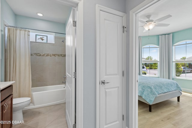 831 Coral Reef Way, Daytona Beach, FL 32124 - ensuite bathroom featuring shower / bath combo with shower curtain, toilet, a ceiling fan, wood finished floors, and vanity