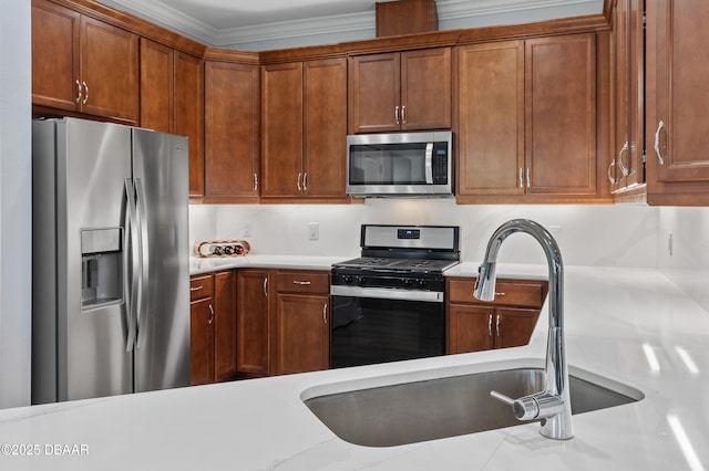 831 Coral Reef Way, Daytona Beach, FL 32124 - kitchen with light countertops, brown cabinets, appliances with stainless steel finishes, and a sink