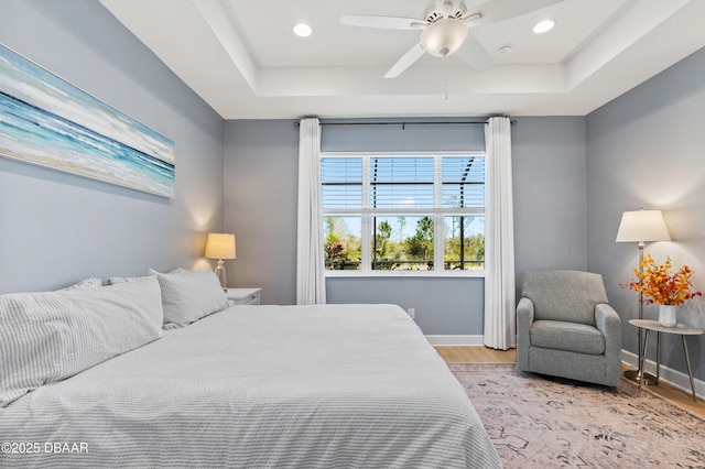 831 Coral Reef Way, Daytona Beach, FL 32124 - bedroom featuring recessed lighting, a raised ceiling, baseboards, and wood finished floors