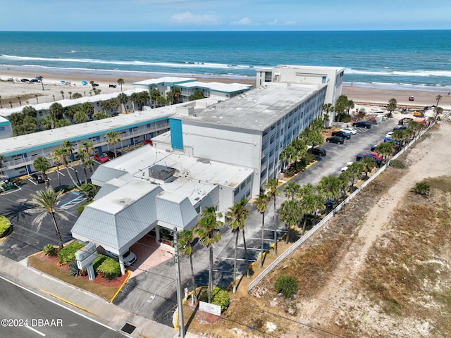 bird's eye view featuring a water view and a view of the beach