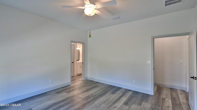 spare room featuring ceiling fan and wood-type flooring