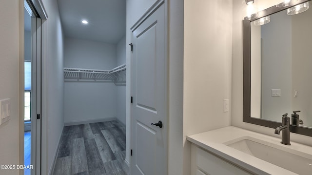 bathroom featuring hardwood / wood-style floors and vanity