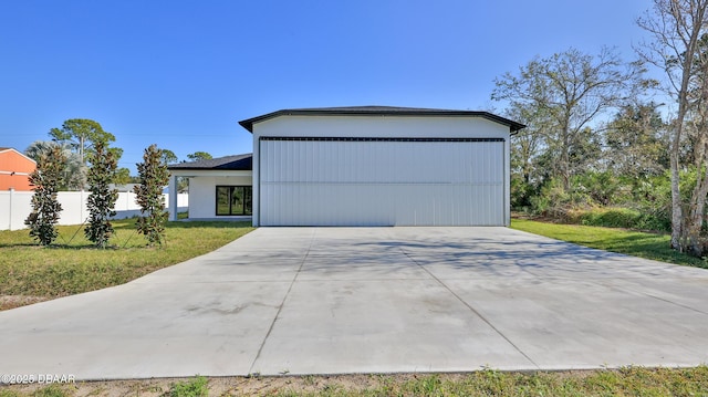 view of front of house with a garage and a front yard