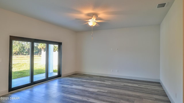 empty room with hardwood / wood-style flooring and ceiling fan