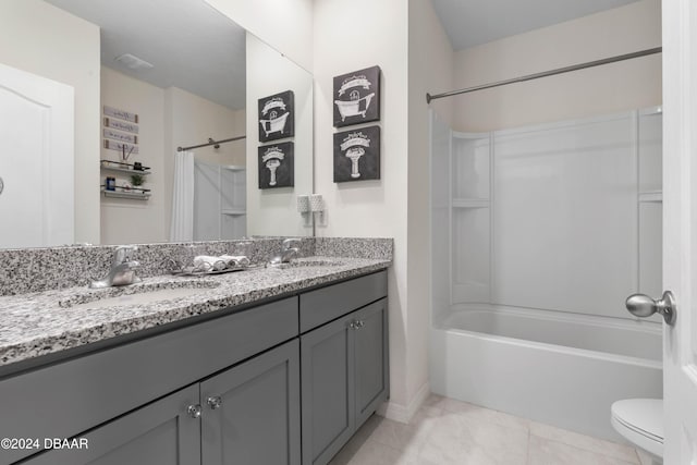 full bathroom with tile patterned floors, shower / bathing tub combination, vanity, and toilet