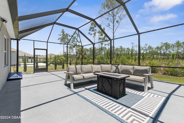 view of patio with glass enclosure and an outdoor hangout area