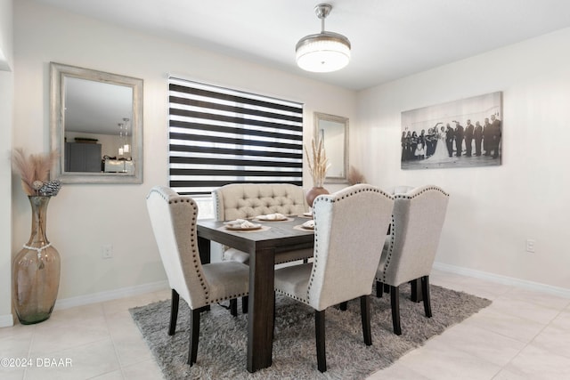 dining space with light tile patterned floors