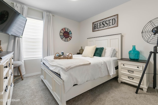 carpeted bedroom with multiple windows