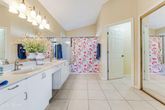 bathroom featuring tile patterned flooring, vanity, curtained shower, and vaulted ceiling