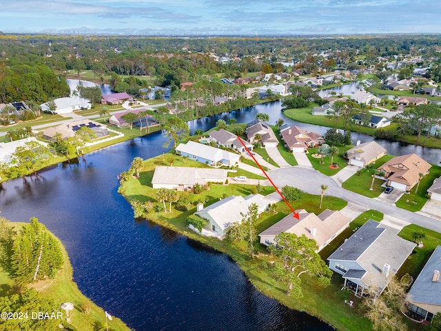 birds eye view of property with a water view