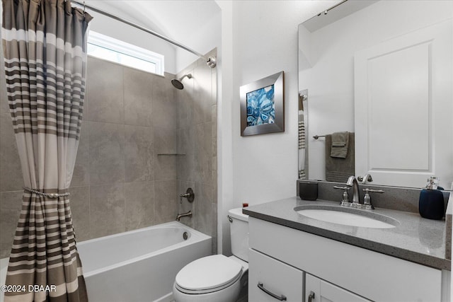 full bathroom featuring vanity, shower / bath combo, and toilet