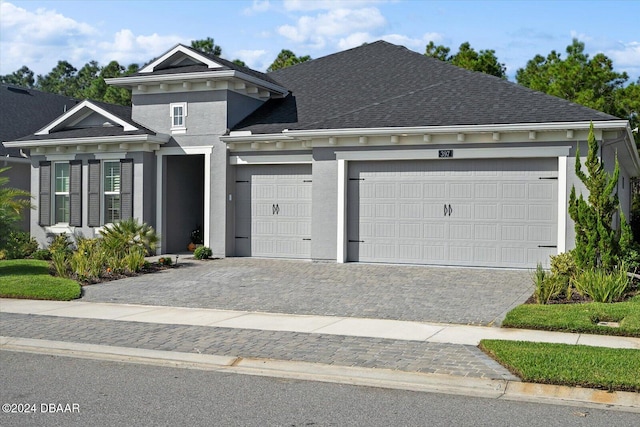 view of front of home with a garage