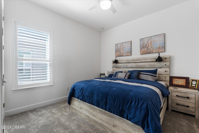 bedroom with multiple windows, carpet, and ceiling fan