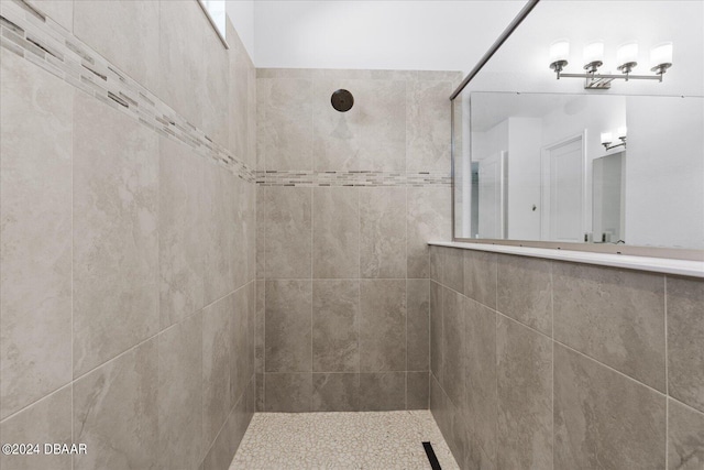 bathroom with a tile shower