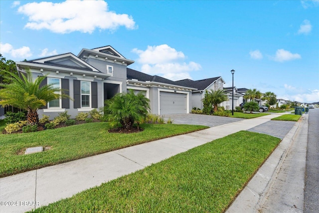 view of front facade featuring a garage and a front yard