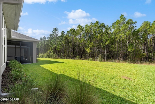 view of yard with a sunroom