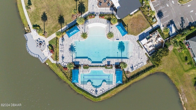 birds eye view of property with a water view